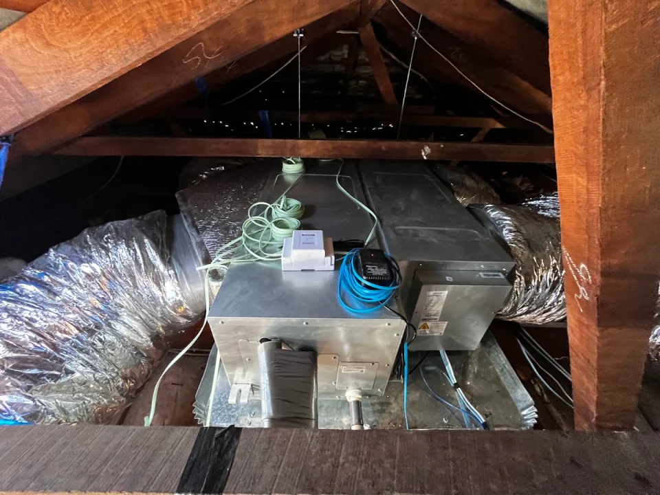 Ducted air-conditioning components being installed in a roof space